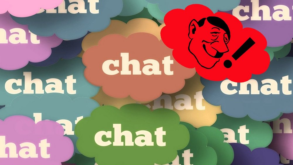 Im Bild sind mehrere Wolken mit dem Wort "Chat" zu sehen, dazwischen eine Wolke mit einer Hitler-Karikatur und einem Rufzeichen
