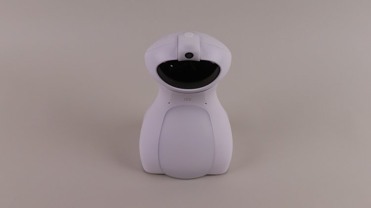 Ein weißer, eher länglicher Roboter mit schwarzem Display steht vor grauem Hintergrund.